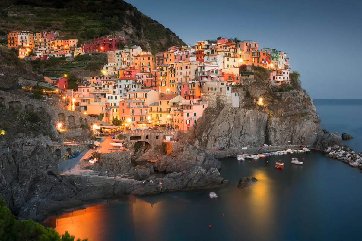 Manarola's colourful houses and harbour at dusk, Cinque Terre, Liguria